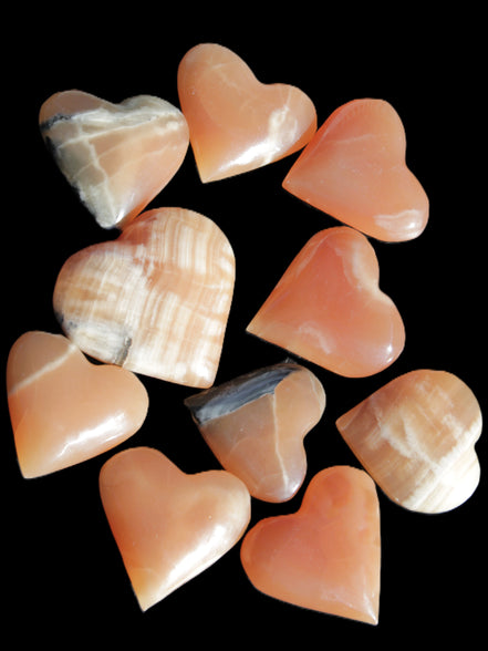 Ten Honey Calcite hearts selection 53-60mm 969g Wholesale Rocks and Things Store