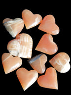 Ten Honey Calcite hearts selection 53-60mm 969g Wholesale Rocks and Things Store