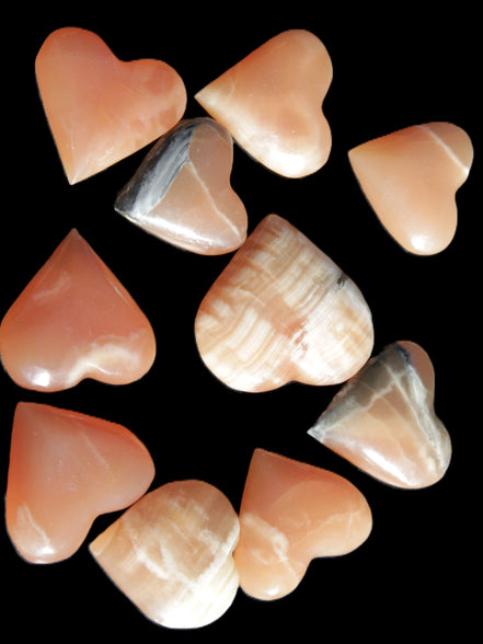 Ten Honey Calcite hearts selection 53-60mm 969g Wholesale Rocks and Things Store