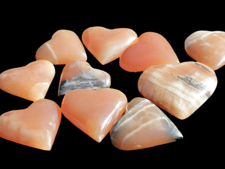 Ten Honey Calcite hearts selection 53-60mm 969g Wholesale Rocks and Things Store