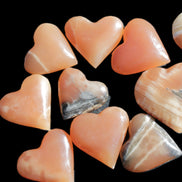 Ten Honey Calcite hearts selection 53-60mm 969g Wholesale Rocks and Things Store