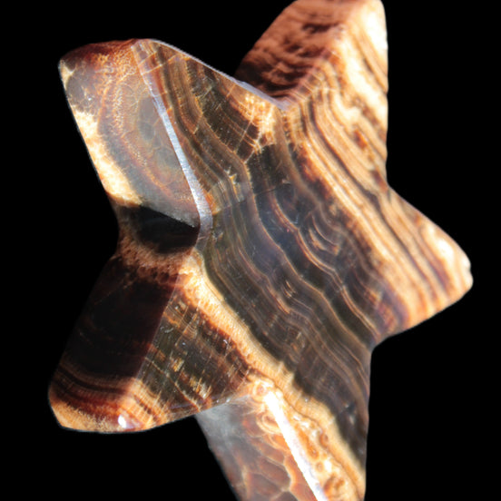 Chocolate Calcite Star 101*20mm 277.3g in sunlight - Rocks and Things Store