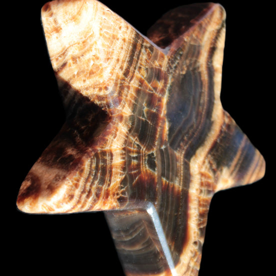 Chocolate Calcite Star 101*20mm 277.3g in sunlight - Rocks and Things Store
