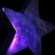 Chocolate Calcite Star 103*19mm 243.3g in UV light - Rocks and Things Store