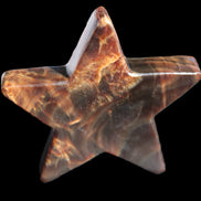 Chocolate Calcite Star 103*19mm 243.3g in very bright sunshine - Rocks and Things Store