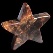 Chocolate Calcite Star 103*19mm 243.3g in very bright sunshine - Rocks and Things Store