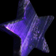 Chocolate Calcite Star 103*18mm 249.6g in UV light - Rocks and Things Store