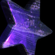 Chocolate Calcite Star 103*18mm 249.6g in UV light - Rocks and Things Store