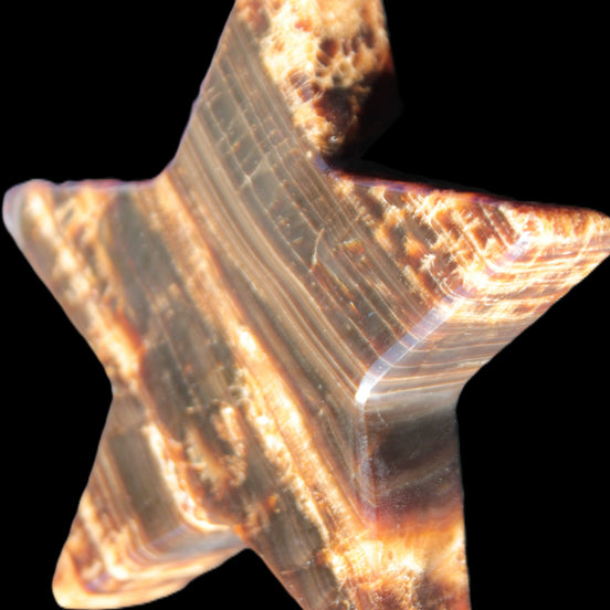 Chocolate Calcite Star 103*18mm 249.6g in sunlight - Rocks and Things Store