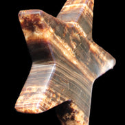 Chocolate Calcite Star 103*18mm 249.6g in bright sunshine - Rocks and Things Store