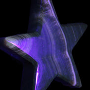 Chocolate Calcite Star 105*20mm 266.5g in UV light - Rocks and Things Store