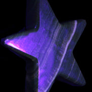 Chocolate Calcite Star 105*20mm 266.5g in UV light - Rocks and Things Store