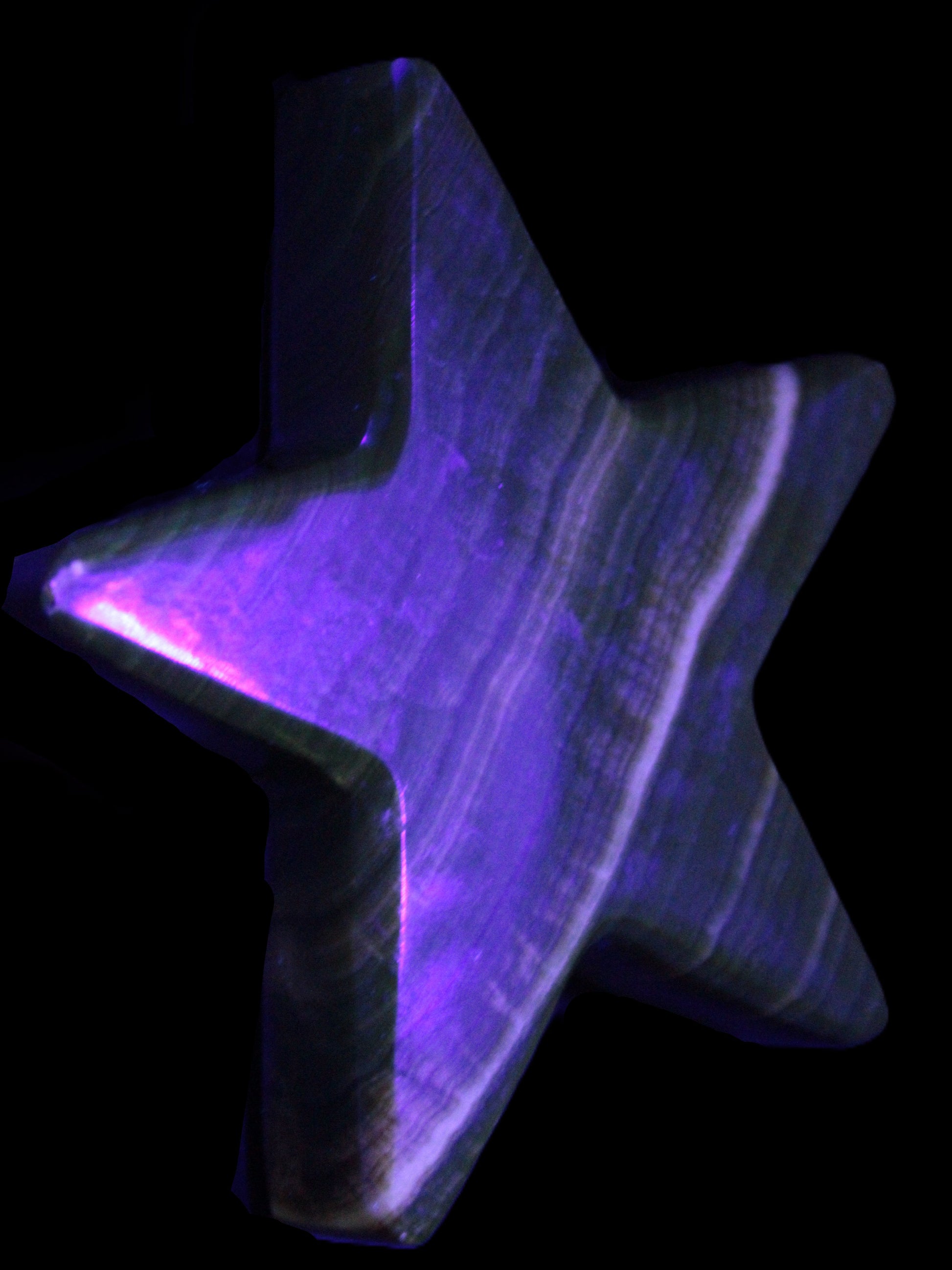 Chocolate Calcite Star 105*20mm 266.5g in UV light - Rocks and Things Store