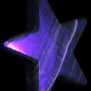 Chocolate Calcite Star 105*20mm 266.5g in UV light - Rocks and Things Store