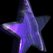 Chocolate Calcite Star 105*20mm 266.5g in UV light - Rocks and Things Store