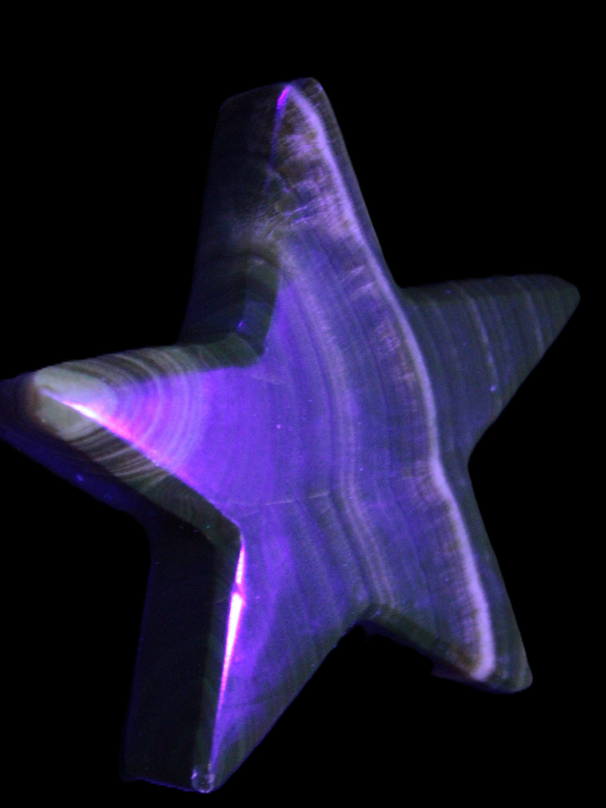 Chocolate Calcite Star 105*20mm 266.5g in UV light - Rocks and Things Store