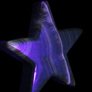 Chocolate Calcite Star 105*20mm 266.5g in UV light - Rocks and Things Store