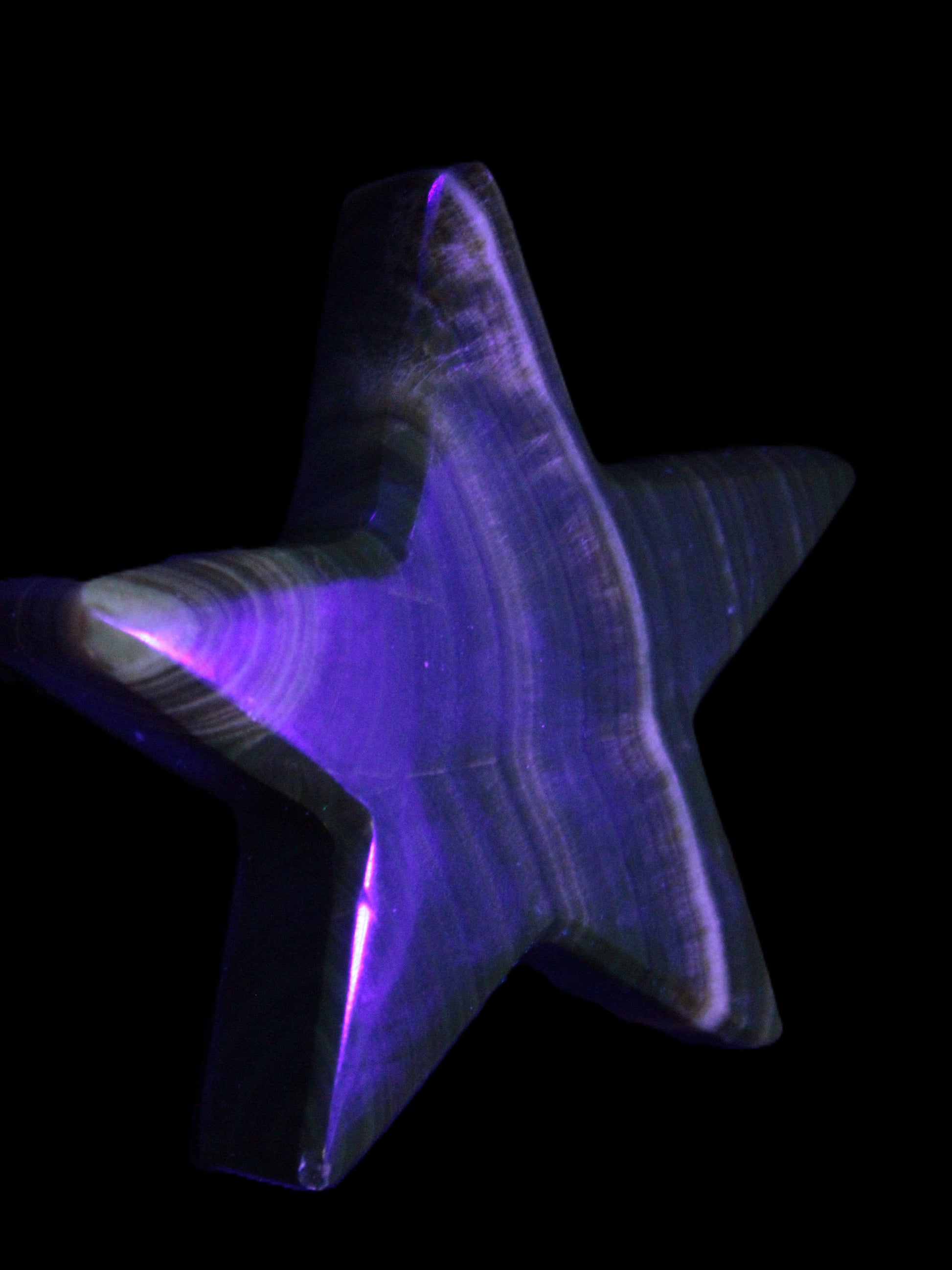 Chocolate Calcite Star 105*20mm 266.5g in UV light - Rocks and Things Store