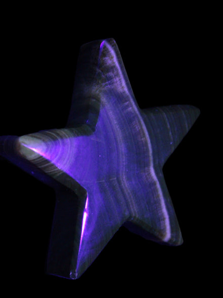 Chocolate Calcite Star 105*20mm 266.5g in UV light - Rocks and Things Store