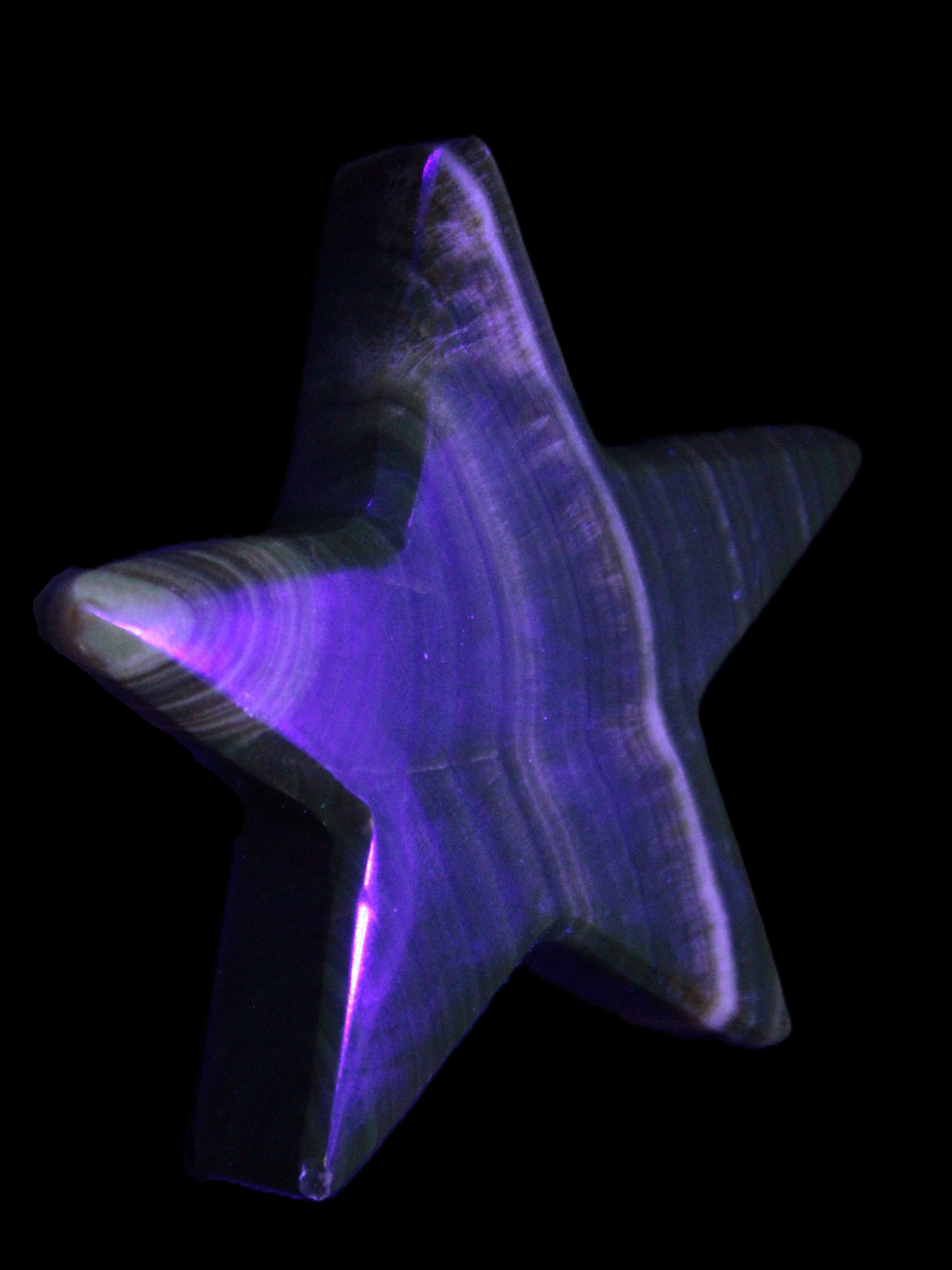Chocolate Calcite Star 105*20mm 266.5g in UV light - Rocks and Things Store