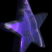 Chocolate Calcite Star 105*20mm 266.5g in UV light - Rocks and Things Store