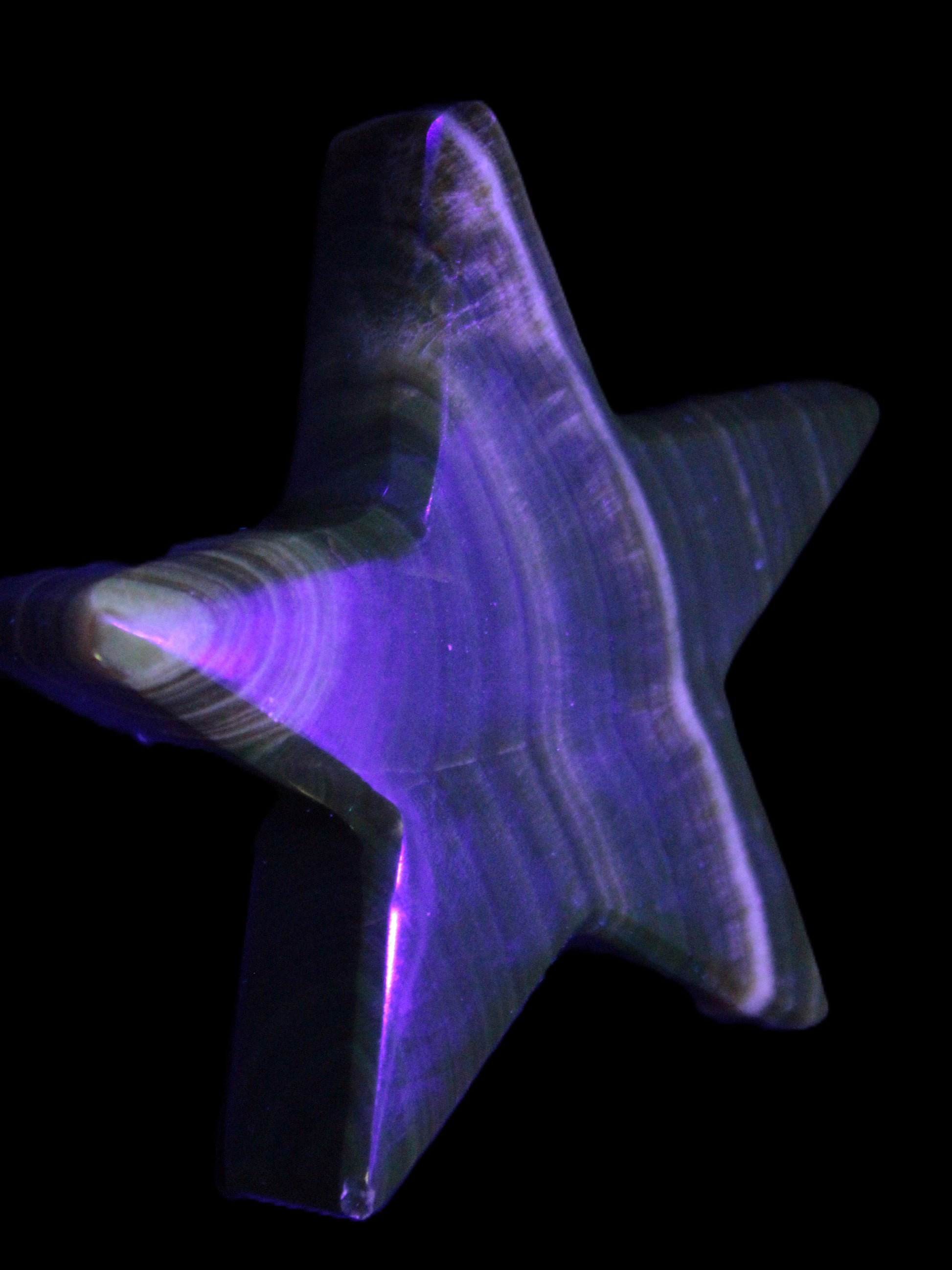 Chocolate Calcite Star 105*20mm 266.5g in UV light - Rocks and Things Store