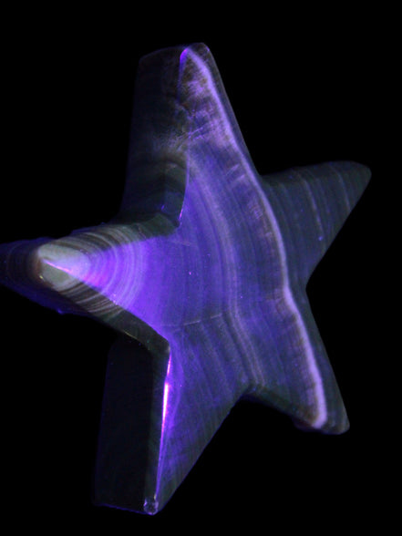 Chocolate Calcite Star 105*20mm 266.5g in UV light - Rocks and Things Store