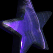 Chocolate Calcite Star 105*20mm 266.5g in UV light - Rocks and Things Store