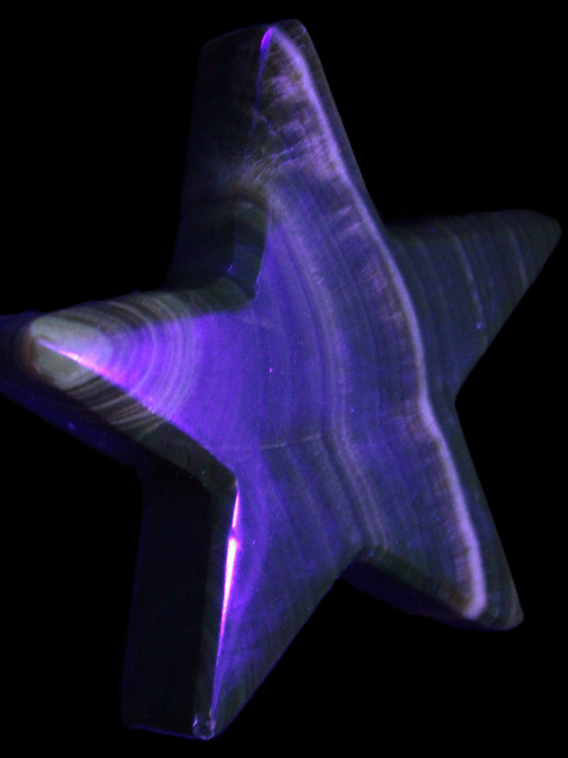 Chocolate Calcite Star 105*20mm 266.5g in UV light - Rocks and Things Store