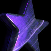 Chocolate Calcite Star 105*20mm 266.5g in UV light - Rocks and Things Store