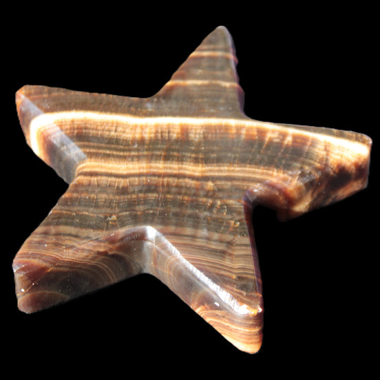 Chocolate Calcite Star 105*20mm 266.5g in sunlight - Rocks and Things Store