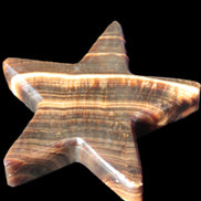 Chocolate Calcite Star 105*20mm 266.5g in bright sunlight - Rocks and Things Store