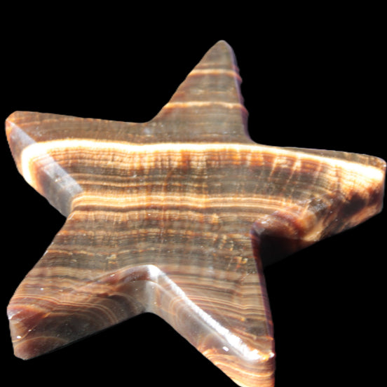 Chocolate Calcite Star 105*20mm 266.5g in sunlight - Rocks and Things Store