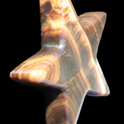 Chocolate Calcite Star 105*20mm 266.5g in bright sunlight - Rocks and Things Store