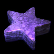 Chocolate Calcite Star 64*21mm 112.2g in UV light  - Rocks and Things Store