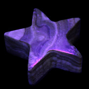 Chocolate Calcite Star 64*21mm 112.2g in UV light - Rocks and Things Store