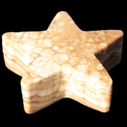 Chocolate Calcite Star 64*21mm 112.2g in bright sunshine - Rocks and Things Store