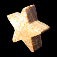 Chocolate Calcite Star 64*21mm 112.2g in bright sunshine - Rocks and Things Store