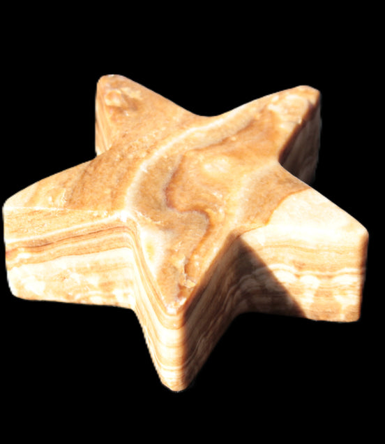 Chocolate Calcite Star 64*21mm 112.2g in bright sunshine - Rocks and Things Store