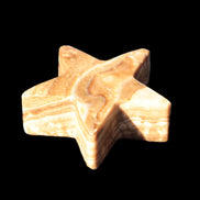 Chocolate Calcite Star 64*21mm 112.2g in bright sunshine - Rocks and Things Store