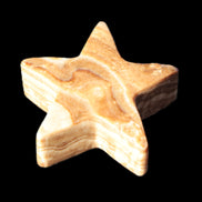 Chocolate Calcite Star 64*21mm 112.2g in bright sunshine - Rocks and Things Store