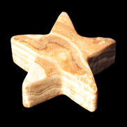 Chocolate Calcite Star 64*21mm 112.2g in bright sunshine - Rocks and Things Store