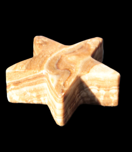 Chocolate Calcite Star 64*21mm 112.2g in bright sunshine - Rocks and Things Store