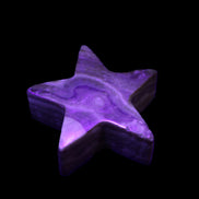 Chocolate Calcite Star 64*21mm 112.2g in UV light - Rocks and Things Store