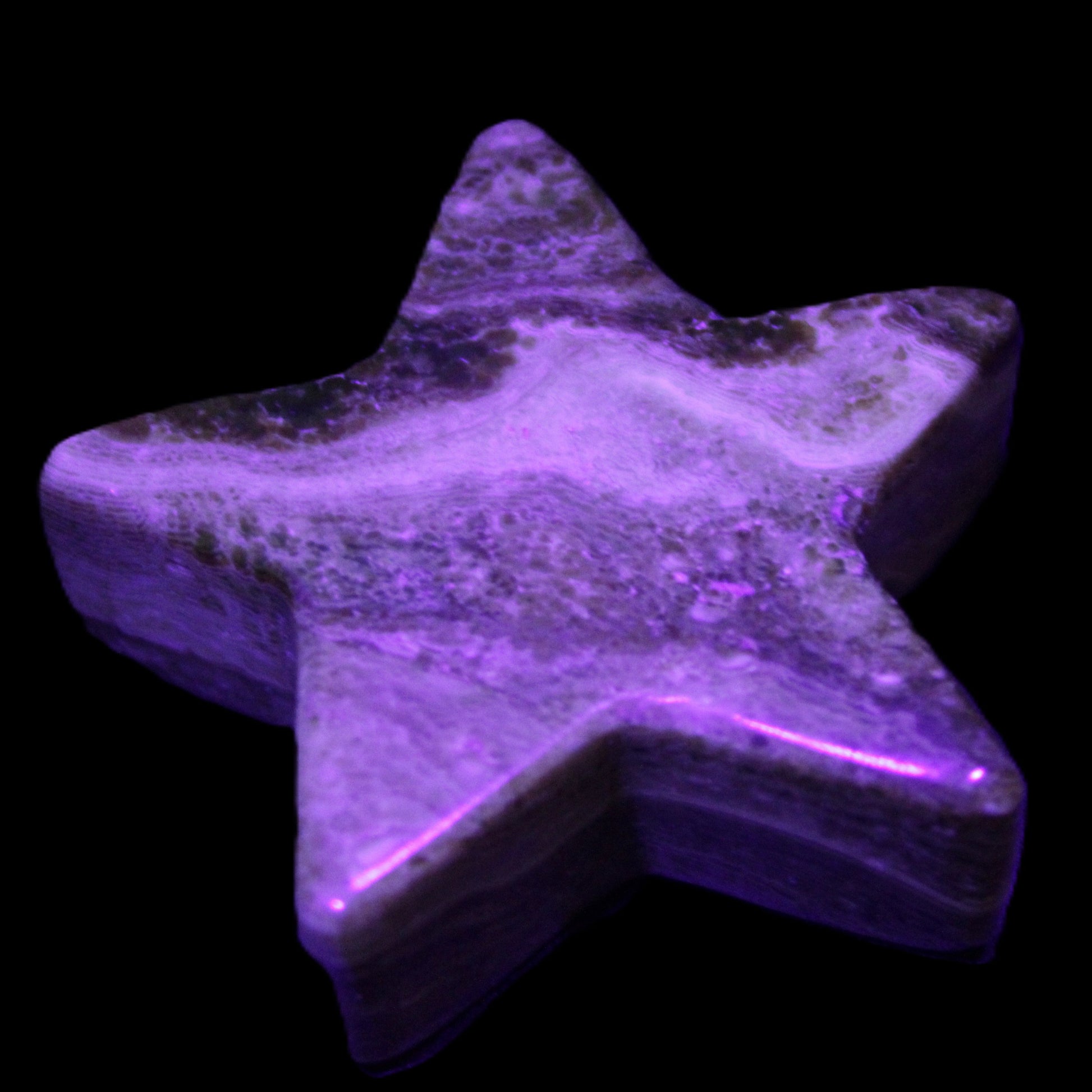 Chocolate Calcite Star 65*18mm 107.2g in UV light - Rocks and Things Store