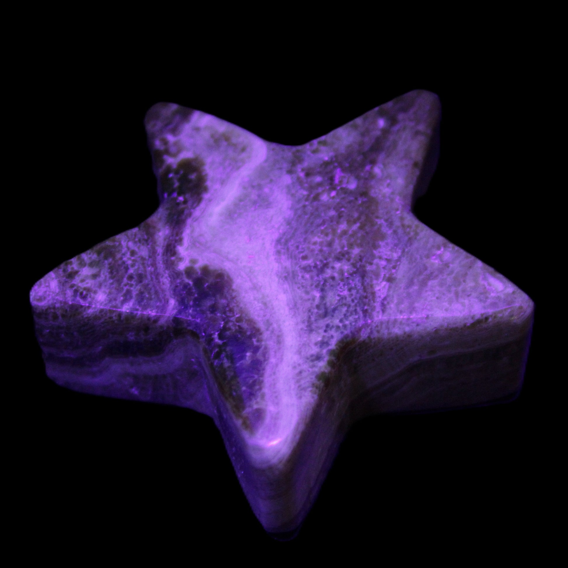 Chocolate Calcite Star 65*18mm 107.2g in UV light - Rocks and Things Store