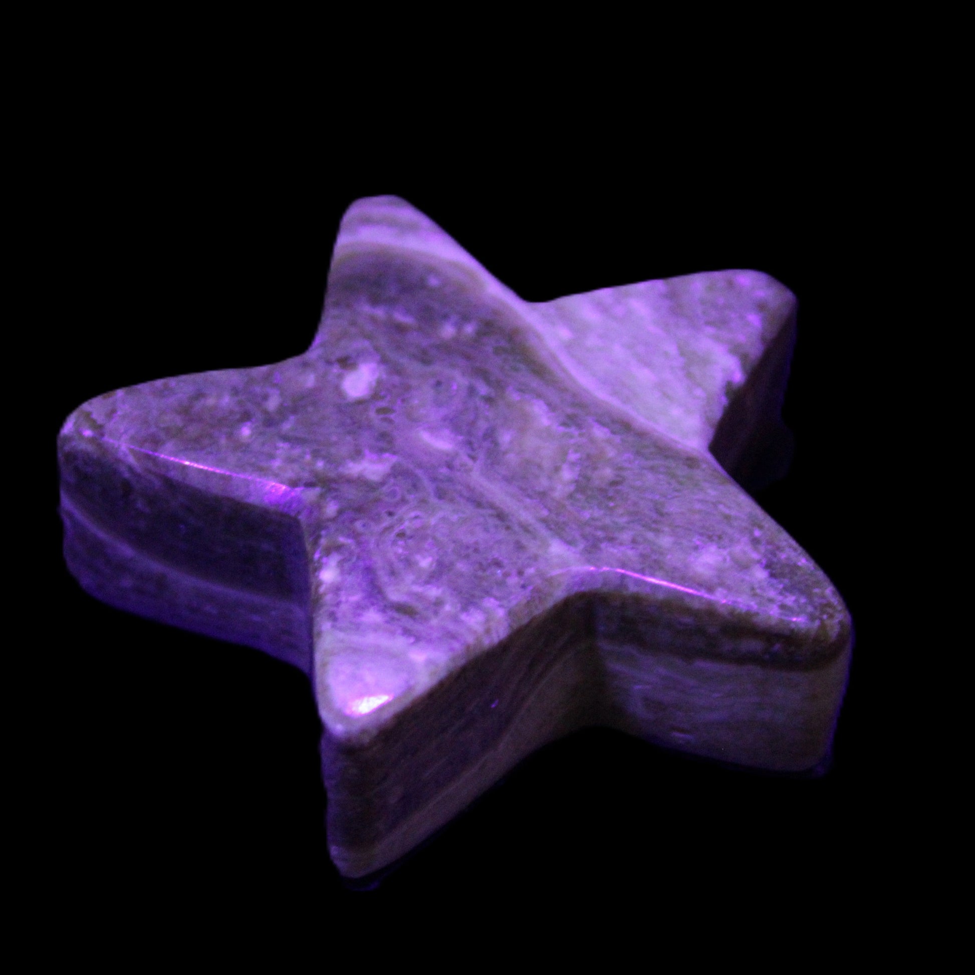 Chocolate Calcite Star 65*18mm 107.2g in UV light - Rocks and Things Store