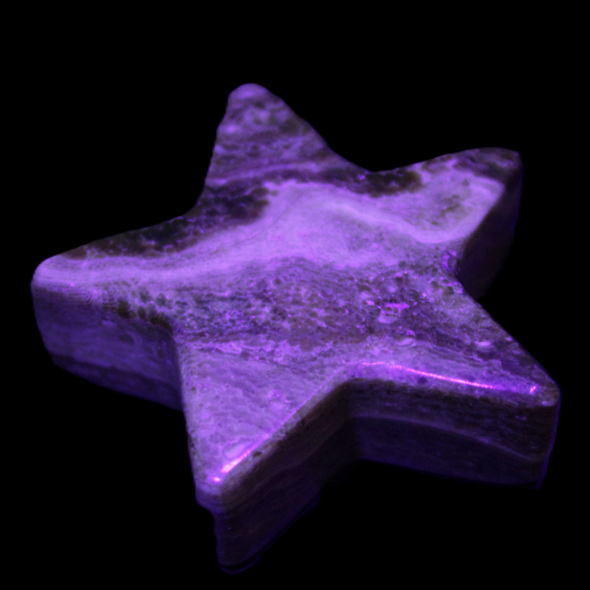 Chocolate Calcite Star 65*18mm 107.2g in UV light - Rocks and Things Store