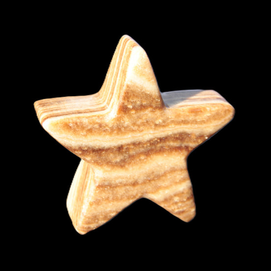Chocolate Calcite Star 66*22mm 120g in sunlight - Rocks and Things Store