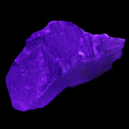 Clear with Purple Fluorite cluster 92*45*42mm 216.8g in UV light